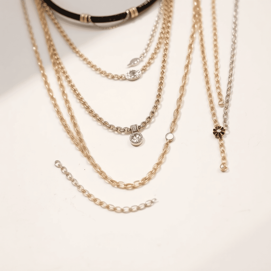 Close-up of layered necklaces with varied lengths and textures on a minimalist background, highlighted by soft lighting to showcase fine craftsmanship.