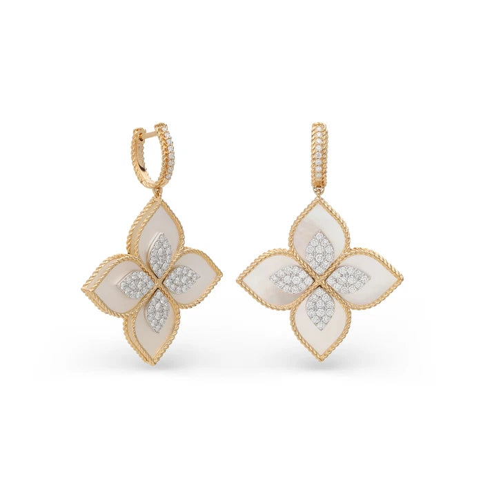 A pair of gold and white mother-of-pearl four-petal drop earrings with pavé diamond accents, shown on a clean white background.